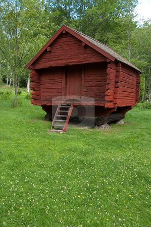 To use this stock image in your creative project, please select the size you need over to the right and click the "Add to Cart" button.
Your downloaded image will come with the Cutcaster watermark removed so don’t worry about the watermark you see on this page. Old Red Log House stock photo, A old red wooden log house, summer or spring time in sweden. by Peter Soderstrom