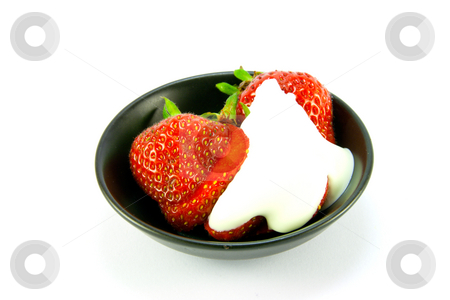 To use this stock image in your creative project, please select the size you need over to the right and click the "Add to Cart" button.
Your downloaded image will come with the Cutcaster watermark removed so don’t worry about the watermark you see on this page. Strawberries and Cream stock photo, Sliced and whole red fresh strawberries with cream in a small black dish on a white background by Keith Wilson
