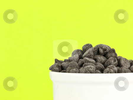 To use this stock image in your creative project, please select the size you need over to the right and click the "Add to Cart" button.
Your downloaded image will come with the Cutcaster watermark removed so don’t worry about the watermark you see on this page. Chocolate chips on green stock photo, Chocolate chips on green background with copy space by John Teeter