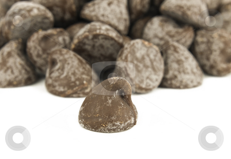 To use this stock image in your creative project, please select the size you need over to the right and click the "Add to Cart" button.
Your downloaded image will come with the Cutcaster watermark removed so don’t worry about the watermark you see on this page. Chocolate chip pile stock photo, Pile of Chocolate Chips on a White Background by John Teeter