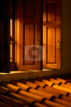 To use this stock image in your creative project, please select the size you need over to the right and click the "Add to Cart" button.
Your downloaded image will come with the Cutcaster watermark removed so don’t worry about the watermark you see on this page. Let there be light stock photo, Picture shows an open window allowing golden light to illuminate the roof outside by Andreas Karelias