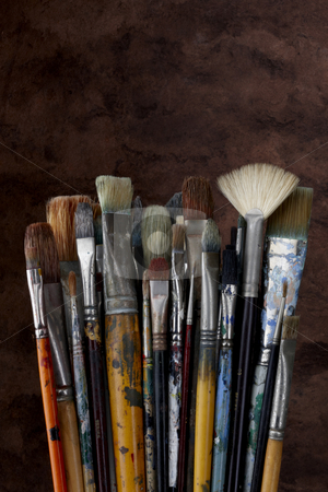 To use this stock image in your creative project, please select the size you need over to the right and click the "Add to Cart" button.
Your downloaded image will come with the Cutcaster watermark removed so don’t worry about the watermark you see on this page. Close up of artist paint brushes on dark textured background stock photo, Dozens of artists brushes shot with dark textured background by James Barber