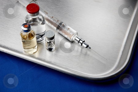 To use this stock image in your creative project, please select the size you need over to the right and click the "Add to Cart" button.
Your downloaded image will come with the Cutcaster watermark removed so don’t worry about the watermark you see on this page. Vaccination still life stock photo, Hypodermic needle and vials on stainless steel surface by James Barber