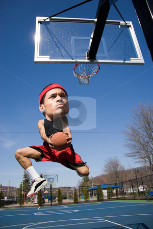 To use this stock image in your creative project, please select the size you need over to the right and click the "Add to Cart" button.
Your downloaded image will come with the Cutcaster watermark removed so don’t worry about the watermark you see on this page. Big Head Basketball Player stock photo, A basketball player with a large head driving to the hoop with some fancy moves. by Todd Arena