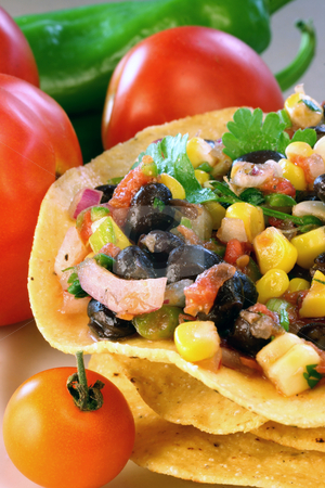 To use this stock image in your creative project, please select the size you need over to the right and click the "Add to Cart" button.
Your downloaded image will come with the Cutcaster watermark removed so don’t worry about the watermark you see on this page. Black Bean and Corn Salsa stock photo, Black bean and corn salsa on tostados by Linda Schhirmbeck