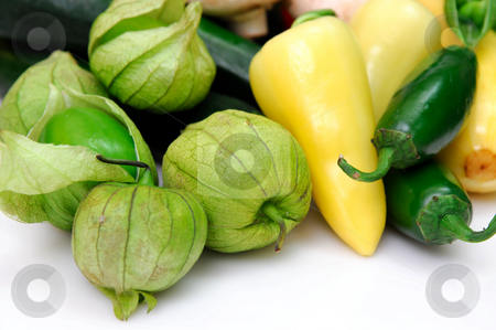 To use this stock image in your creative project, please select the size you need over to the right and click the "Add to Cart" button.
Your downloaded image will come with the Cutcaster watermark removed so don’t worry about the watermark you see on this page. Tomatillo And Chili Peppers stock photo, Yellow and green chili peppers with fresh tomatillos, ingredients for salsa on a white background. by Lynn Bendickson