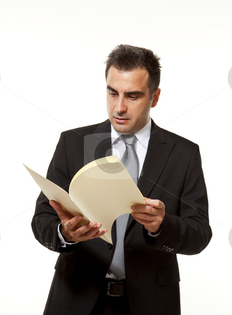 To use this stock image in your creative project, please select the size you need over to the right and click the "Add to Cart" button.
Your downloaded image will come with the Cutcaster watermark removed so don’t worry about the watermark you see on this page. Businessman with document stock photo, Businessman reads a document with query by Marios Karampalis