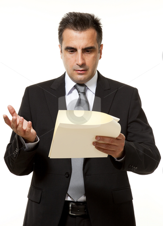 To use this stock image in your creative project, please select the size you need over to the right and click the "Add to Cart" button.
Your downloaded image will come with the Cutcaster watermark removed so don’t worry about the watermark you see on this page. Businessman with document stock photo, Businessman reads a document with query by Marios Karampalis