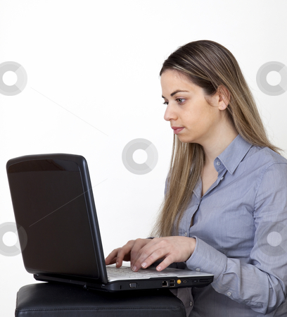 To use this stock image in your creative project, please select the size you need over to the right and click the "Add to Cart" button.
Your downloaded image will come with the Cutcaster watermark removed so don’t worry about the watermark you see on this page. Young women with laptop stock photo, Young girl, writes in her computer by Marios Karampalis