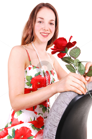 To use this stock image in your creative project, please select the size you need over to the right and click the "Add to Cart" button.
Your downloaded image will come with the Cutcaster watermark removed so don’t worry about the watermark you see on this page. Pretty girl in dress with rose. stock photo, Pretty young woman sitting on a office chair backwards in a nice colorful
dress and holding an red rose in her hand. For white background. by Horst Petzold