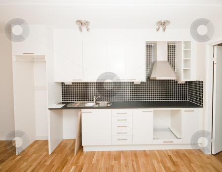 To use this stock image in your creative project, please select the size you need over to the right and click the "Add to Cart" button.
Your downloaded image will come with the Cutcaster watermark removed so don’t worry about the watermark you see on this page. New kitchen stock photo, New kitchen by Fredrik Elfdahl