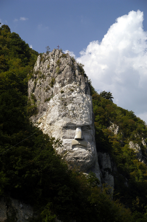 To use this stock image in your creative project, please select the size you need over to the right and click the "Add to Cart" button.
Your downloaded image will come with the Cutcaster watermark removed so don’t worry about the watermark you see on this page. King Decebalus stock photo, Romania, Iron Gate gorge, Danube River, Monument to King Decebalus by David Ryan
