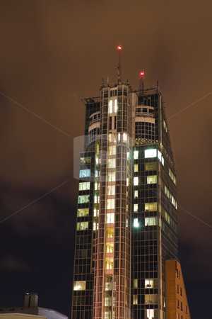 To use this stock image in your creative project, please select the size you need over to the right and click the "Add to Cart" button.
Your downloaded image will come with the Cutcaster watermark removed so don’t worry about the watermark you see on this page. Skyscraper stock photo, Skyscraper rising in the night by Fredrik Elfdahl