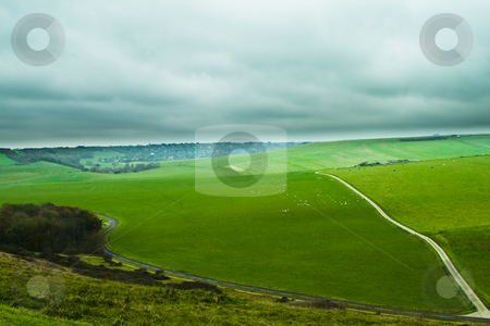 To use this stock image in your creative project, please select the size you need over to the right and click the "Add to Cart" button.
Your downloaded image will come with the Cutcaster watermark removed so don’t worry about the watermark you see on this page. Green hill stock photo, Green hill with a road by Fredrik Elfdahl