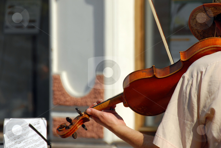 To use this stock image in your creative project, please select the size you need over to the right and click the "Add to Cart" button.
Your downloaded image will come with the Cutcaster watermark removed so don’t worry about the watermark you see on this page. Street musician stock photo, Street violinist playing a violin with music sheet by Julija Sapic