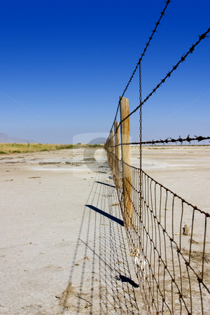 To use this stock image in your creative project, please select the size you need over to the right and click the "Add to Cart" button.
Your downloaded image will come with the Cutcaster watermark removed so don’t worry about the watermark you see on this page. Fence Under Clear Skies stock photo, Fence in the Salt Lake in Summer in Utah with Clear Blue Skies by Mehmet Dilsiz