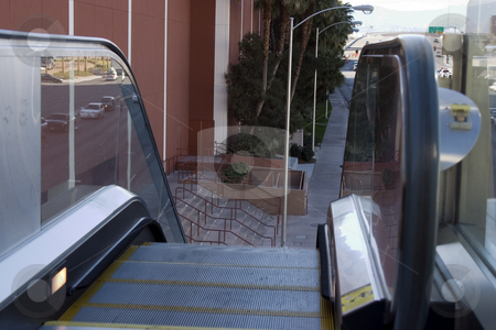 To use this stock image in your creative project, please select the size you need over to the right and click the "Add to Cart" button.
Your downloaded image will come with the Cutcaster watermark removed so don’t worry about the watermark you see on this page. Escalators going down to the street in Las Vegas stock photo, Escalators going down to the street in Las Vegas with the city in the background by Mehmet Dilsiz