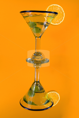 To use this stock image in your creative project, please select the size you need over to the right and click the "Add to Cart" button.
Your downloaded image will come with the Cutcaster watermark removed so don’t worry about the watermark you see on this page. Martini Glass on a Mirror stock photo, Martini Glass - Isolated on Orange Background by Mehmet Dilsiz