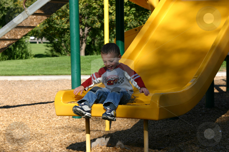 To use this stock image in your creative project, please select the size you need over to the right and click the "Add to Cart" button.
Your downloaded image will come with the Cutcaster watermark removed so don’t worry about the watermark you see on this page. Little Boy Sliding stock photo, Little Boy sitting at the end of a Slider by Mehmet Dilsiz