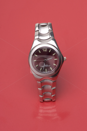To use this stock image in your creative project, please select the size you need over to the right and click the "Add to Cart" button.
Your downloaded image will come with the Cutcaster watermark removed so don’t worry about the watermark you see on this page. Red watch stock photo, Men sport watch on red reflective surface by Yann Poirier
