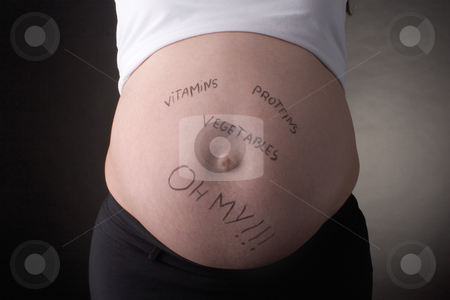To use this stock image in your creative project, please select the size you need over to the right and click the "Add to Cart" button.
Your downloaded image will come with the Cutcaster watermark removed so don’t worry about the watermark you see on this page. Vitamines, proteins, vegetables oh my belly stock photo, Seven month pregnant belly with vitamines, proteins, vegetables, oh my written on stomach by Yann Poirier