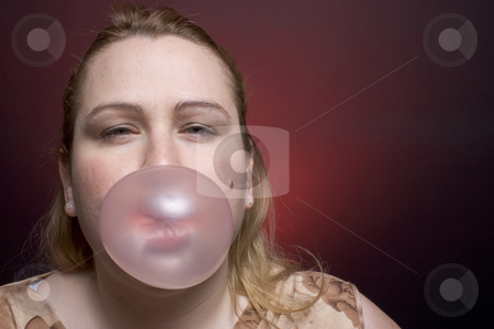 To use this stock image in your creative project, please select the size you need over to the right and click the "Add to Cart" button.
Your downloaded image will come with the Cutcaster watermark removed so don’t worry about the watermark you see on this page. Women blowing big bubble stock photo, Women blowing a big bubble gum by Yann Poirier