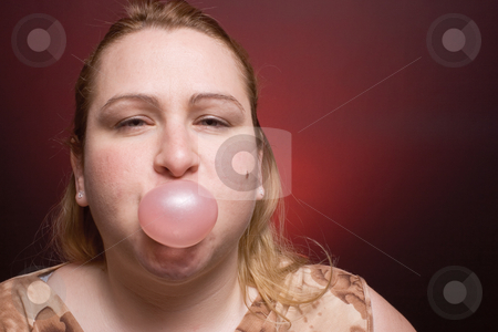 To use this stock image in your creative project, please select the size you need over to the right and click the "Add to Cart" button.
Your downloaded image will come with the Cutcaster watermark removed so don’t worry about the watermark you see on this page. Women blowing bubble stock photo, Women blowing small bubble gum by Yann Poirier