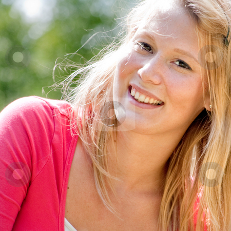 To use this stock image in your creative project, please select the size you need over to the right and click the "Add to Cart" button.
Your downloaded image will come with the Cutcaster watermark removed so don’t worry about the watermark you see on this page. Young blond smiling woman outside stock photo, A blond woman in the park with sunny weather by Frenk and Danielle Kaufmann