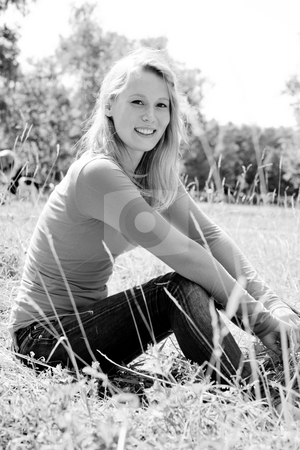 To use this stock image in your creative project, please select the size you need over to the right and click the "Add to Cart" button.
Your downloaded image will come with the Cutcaster watermark removed so don’t worry about the watermark you see on this page. Black and white woman stock photo, A blond woman in the park with sunny weather by Frenk and Danielle Kaufmann