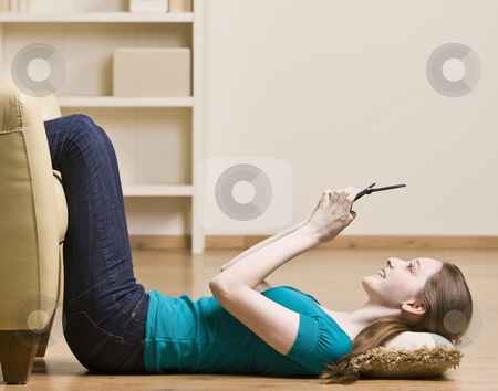 To use this stock image in your creative project, please select the size you need over to the right and click the "Add to Cart" button.
Your downloaded image will come with the Cutcaster watermark removed so don’t worry about the watermark you see on this page. Teenage girl text messaging on cell phone stock photo, Teenage girl text messaging on cell phone by Jonathan Ross