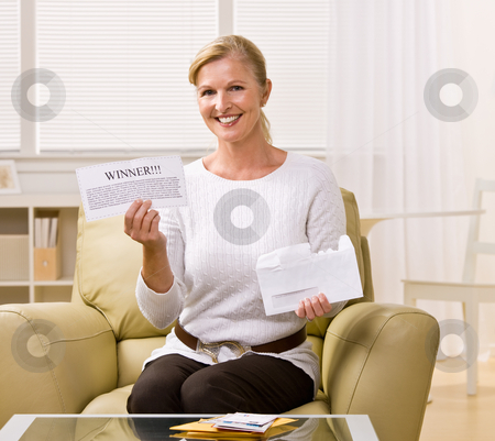 To use this stock image in your creative project, please select the size you need over to the right and click the "Add to Cart" button.
Your downloaded image will come with the Cutcaster watermark removed so don’t worry about the watermark you see on this page. Woman holding ?winner? notification stock photo, Woman holding ?winner? notification by Jonathan Ross