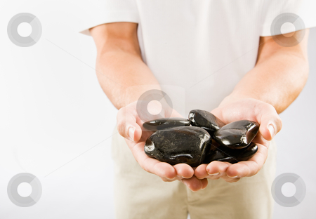 To use this stock image in your creative project, please select the size you need over to the right and click the "Add to Cart" button.
Your downloaded image will come with the Cutcaster watermark removed so don’t worry about the watermark you see on this page. Massage therapist holding warm stones stock photo, Massage therapist holding warm stones by Jonathan Ross