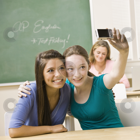 To use this stock image in your creative project, please select the size you need over to the right and click the "Add to Cart" button.
Your downloaded image will come with the Cutcaster watermark removed so don’t worry about the watermark you see on this page. Students taking self-portrait in classroom stock photo, Students taking self-portrait in classroom by Jonathan Ross