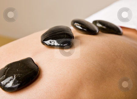 To use this stock image in your creative project, please select the size you need over to the right and click the "Add to Cart" button.
Your downloaded image will come with the Cutcaster watermark removed so don’t worry about the watermark you see on this page. Woman receiving hot stone therapy massage stock photo, Woman receiving hot stone therapy massage by Jonathan Ross