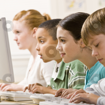 To use this stock image in your creative project, please select the size you need over to the right and click the "Add to Cart" button.
Your downloaded image will come with the Cutcaster watermark removed so don’t worry about the watermark you see on this page. Students working on computers stock photo, Students working on computers by Jonathan Ross
