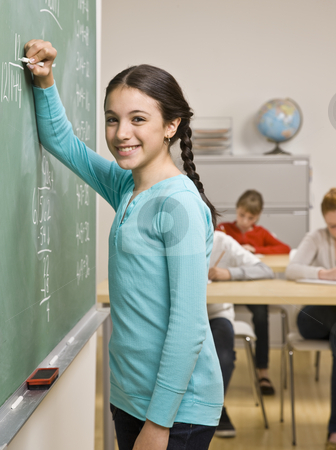 To use this stock image in your creative project, please select the size you need over to the right and click the "Add to Cart" button.
Your downloaded image will come with the Cutcaster watermark removed so don’t worry about the watermark you see on this page. Student writing on blackboard stock photo, Student writing on blackboard by Jonathan Ross