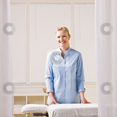 To use this stock image in your creative project, please select the size you need over to the right and click the "Add to Cart" button.
Your downloaded image will come with the Cutcaster watermark removed so don’t worry about the watermark you see on this page. Massage therapist next to massage table stock photo, Massage therapist next to massage table by Jonathan Ross