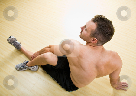 To use this stock image in your creative project, please select the size you need over to the right and click the "Add to Cart" button.
Your downloaded image will come with the Cutcaster watermark removed so don’t worry about the watermark you see on this page. Man stretching in health club stock photo, Man stretching in health club by Jonathan Ross