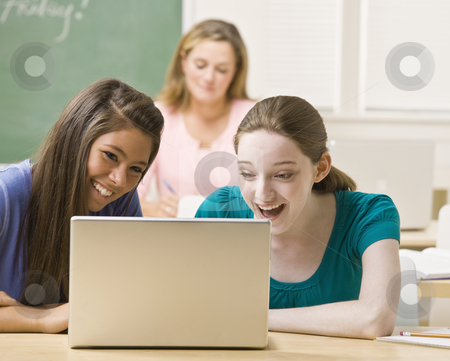 To use this stock image in your creative project, please select the size you need over to the right and click the "Add to Cart" button.
Your downloaded image will come with the Cutcaster watermark removed so don’t worry about the watermark you see on this page. Students sharing laptop in classroom stock photo, Students sharing laptop in classroom by Jonathan Ross