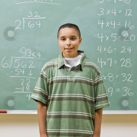 To use this stock image in your creative project, please select the size you need over to the right and click the "Add to Cart" button.
Your downloaded image will come with the Cutcaster watermark removed so don’t worry about the watermark you see on this page. Student standing near blackboard stock photo, Student standing near blackboard by Jonathan Ross