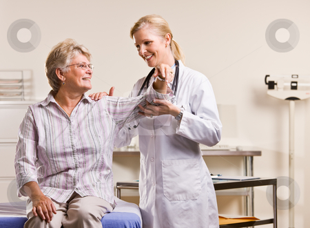 To use this stock image in your creative project, please select the size you need over to the right and click the "Add to Cart" button.
Your downloaded image will come with the Cutcaster watermark removed so don’t worry about the watermark you see on this page. Doctor checking senior woman?s arm stock photo, Doctor checking senior woman?s arm by Jonathan Ross