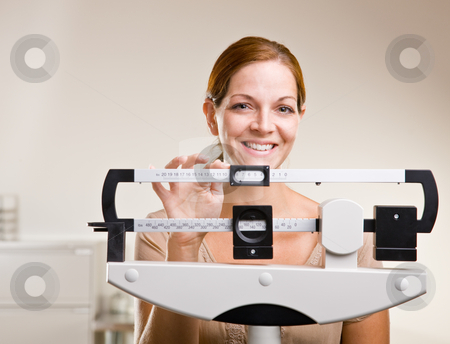 To use this stock image in your creative project, please select the size you need over to the right and click the "Add to Cart" button.
Your downloaded image will come with the Cutcaster watermark removed so don’t worry about the watermark you see on this page. Woman weighing herself in doctor?s office stock photo, Woman weighing herself in doctor?s office by Jonathan Ross
