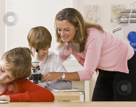 To use this stock image in your creative project, please select the size you need over to the right and click the "Add to Cart" button.
Your downloaded image will come with the Cutcaster watermark removed so don’t worry about the watermark you see on this page. Teacher helping student with microscope stock photo, Teacher helping student with microscope by Jonathan Ross