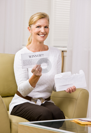 To use this stock image in your creative project, please select the size you need over to the right and click the "Add to Cart" button.
Your downloaded image will come with the Cutcaster watermark removed so don’t worry about the watermark you see on this page. Woman holding ?winner? notification stock photo, Woman holding ?winner? notification by Jonathan Ross