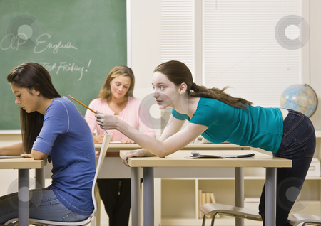 To use this stock image in your creative project, please select the size you need over to the right and click the "Add to Cart" button.
Your downloaded image will come with the Cutcaster watermark removed so don’t worry about the watermark you see on this page. Student tapping classmate in classroom stock photo, Student tapping classmate in classroom by Jonathan Ross