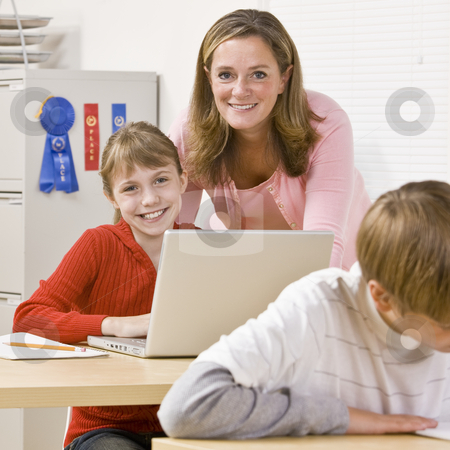To use this stock image in your creative project, please select the size you need over to the right and click the "Add to Cart" button.
Your downloaded image will come with the Cutcaster watermark removed so don’t worry about the watermark you see on this page. Teacher helping student stock photo, Teacher helping student by Jonathan Ross