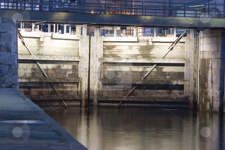 To use this stock image in your creative project, please select the size you need over to the right and click the "Add to Cart" button.
Your downloaded image will come with the Cutcaster watermark removed so don’t worry about the watermark you see on this page. Wooden lock stock photo, Canal lachine closed woodend lock at night by Yann Poirier