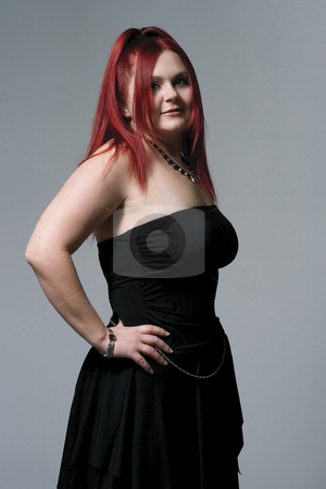 To use this stock image in your creative project, please select the size you need over to the right and click the "Add to Cart" button.
Your downloaded image will come with the Cutcaster watermark removed so don’t worry about the watermark you see on this page. Goth rocker chick stock photo, Red hair female model with goth rock look by Yann Poirier