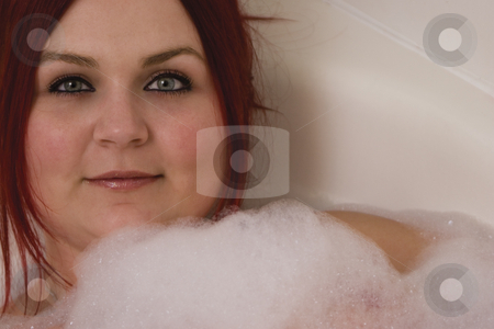 To use this stock image in your creative project, please select the size you need over to the right and click the "Add to Cart" button.
Your downloaded image will come with the Cutcaster watermark removed so don’t worry about the watermark you see on this page. Red hair model in bath stock photo, Close up of a red hair model in bubble bath by Yann Poirier