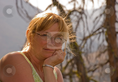 To use this stock image in your creative project, please select the size you need over to the right and click the "Add to Cart" button.
Your downloaded image will come with the Cutcaster watermark removed so don’t worry about the watermark you see on this page. Older Woman Portrait stock photo, This older woman in this portrait is contemplative and thinking in this beauty natural setting, and herself is natural looking. by Valerie Garner